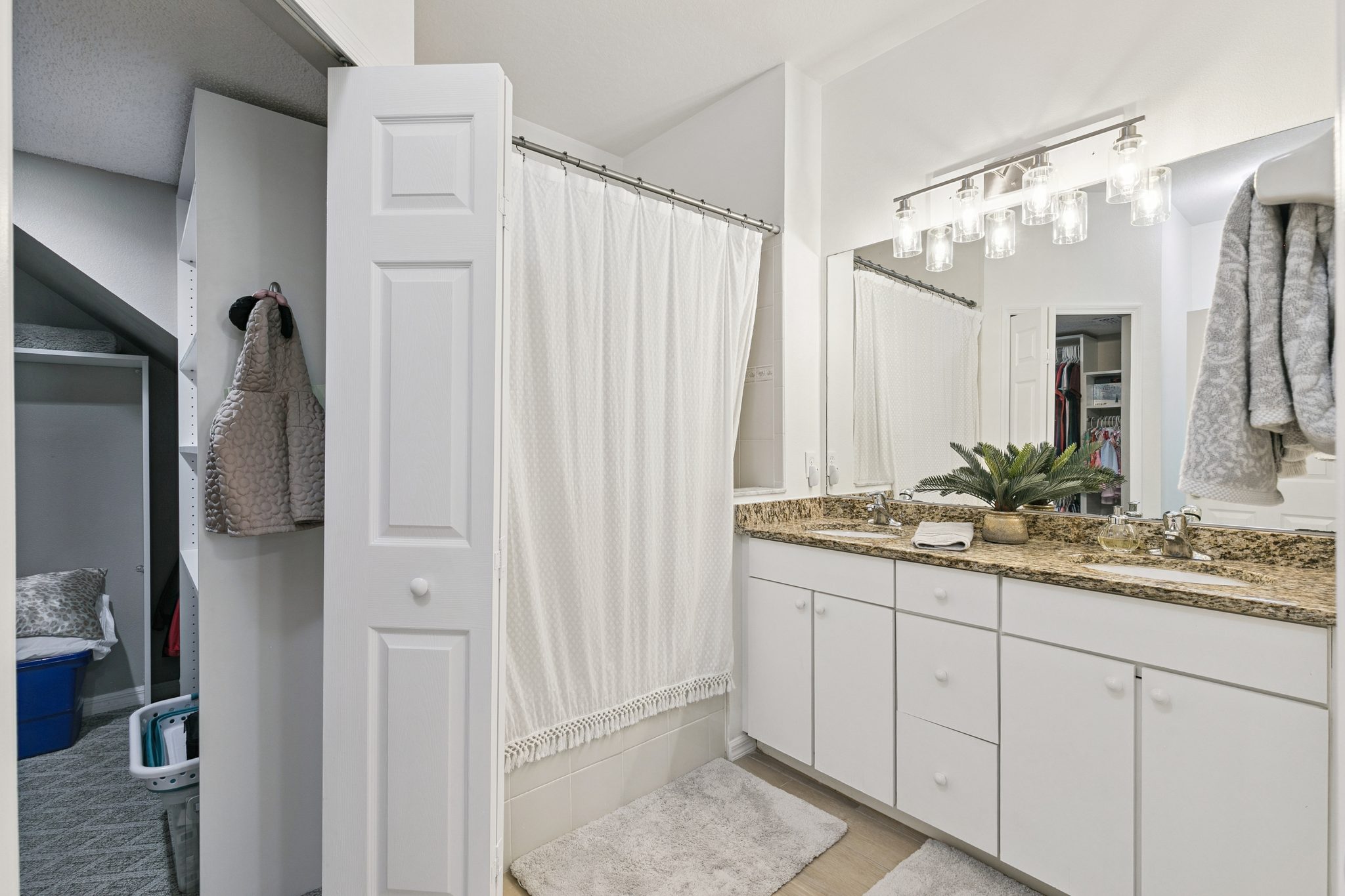 Primary en-suite bath with an extended vanity and framed mirror at 13449 Carroway St, Windermere
