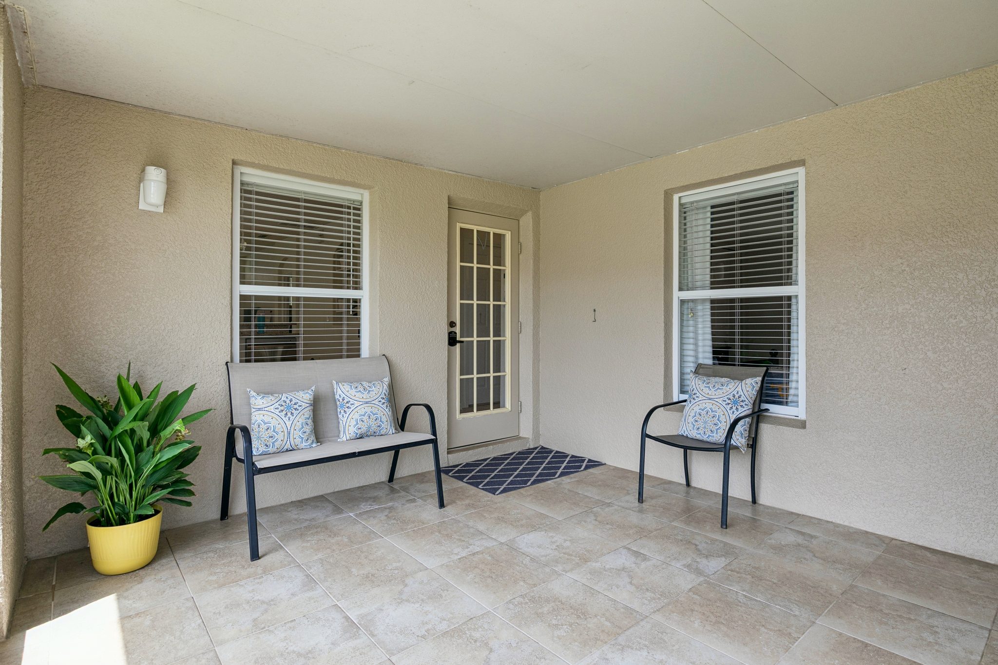 Screened patio with tile flooring — a shaded spot for Florida evenings at 13449 Carroway St, Windermere