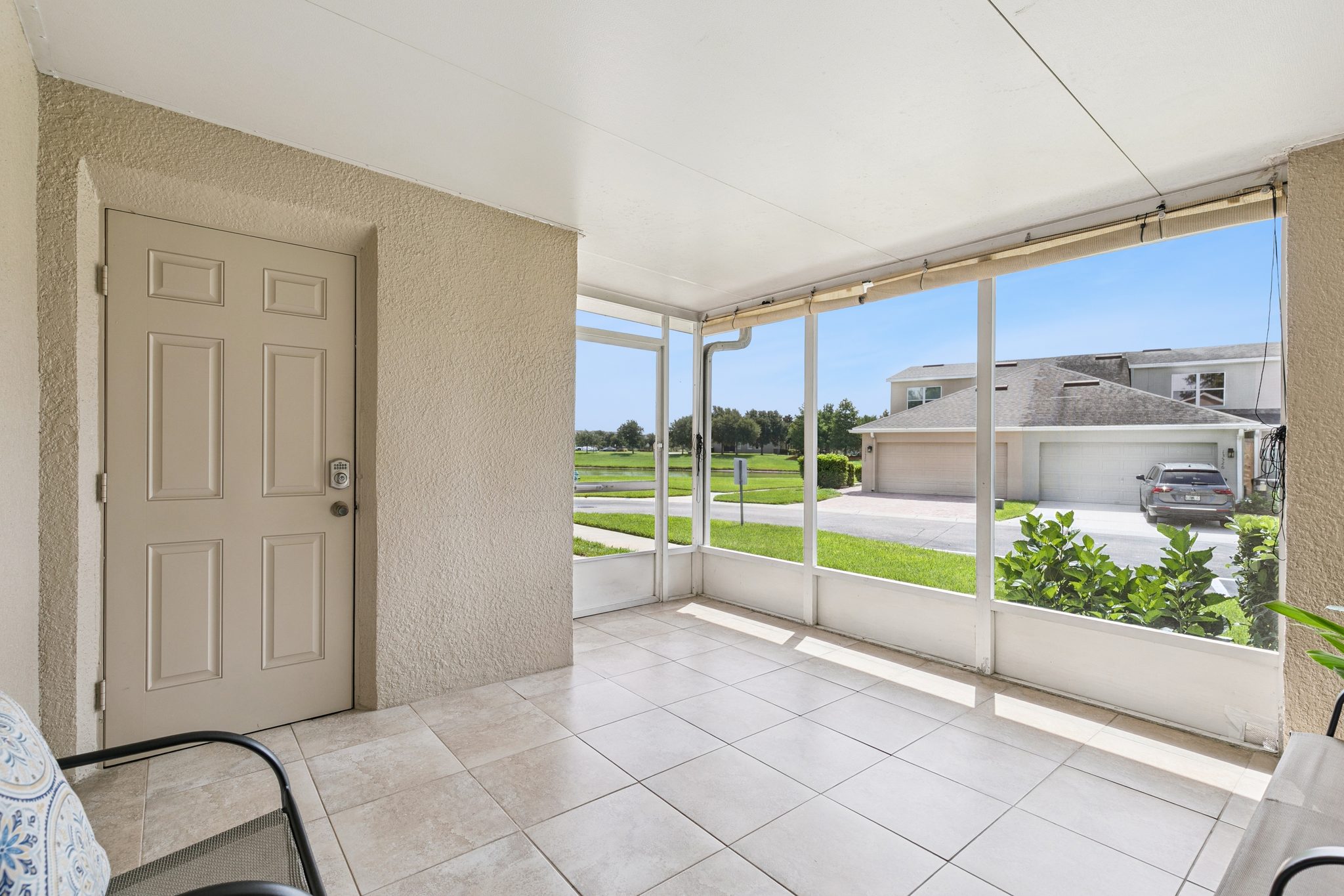 Screened lanai opening to the rear of the home at 13449 Carroway St, Windermere